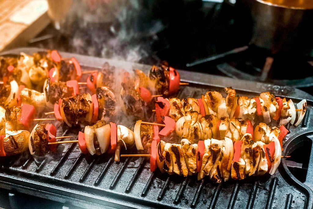 Grilled skewers with colorful vegetables and mushrooms, perfect for pairing with preserved lemon paste recipes.